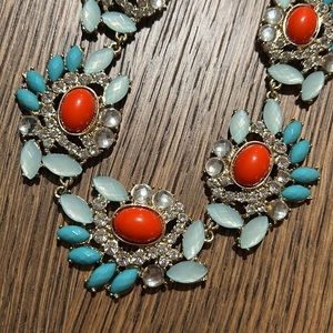 Statement necklace. Gold tone w/turquoise, coral colors. Adjustable 18-20”